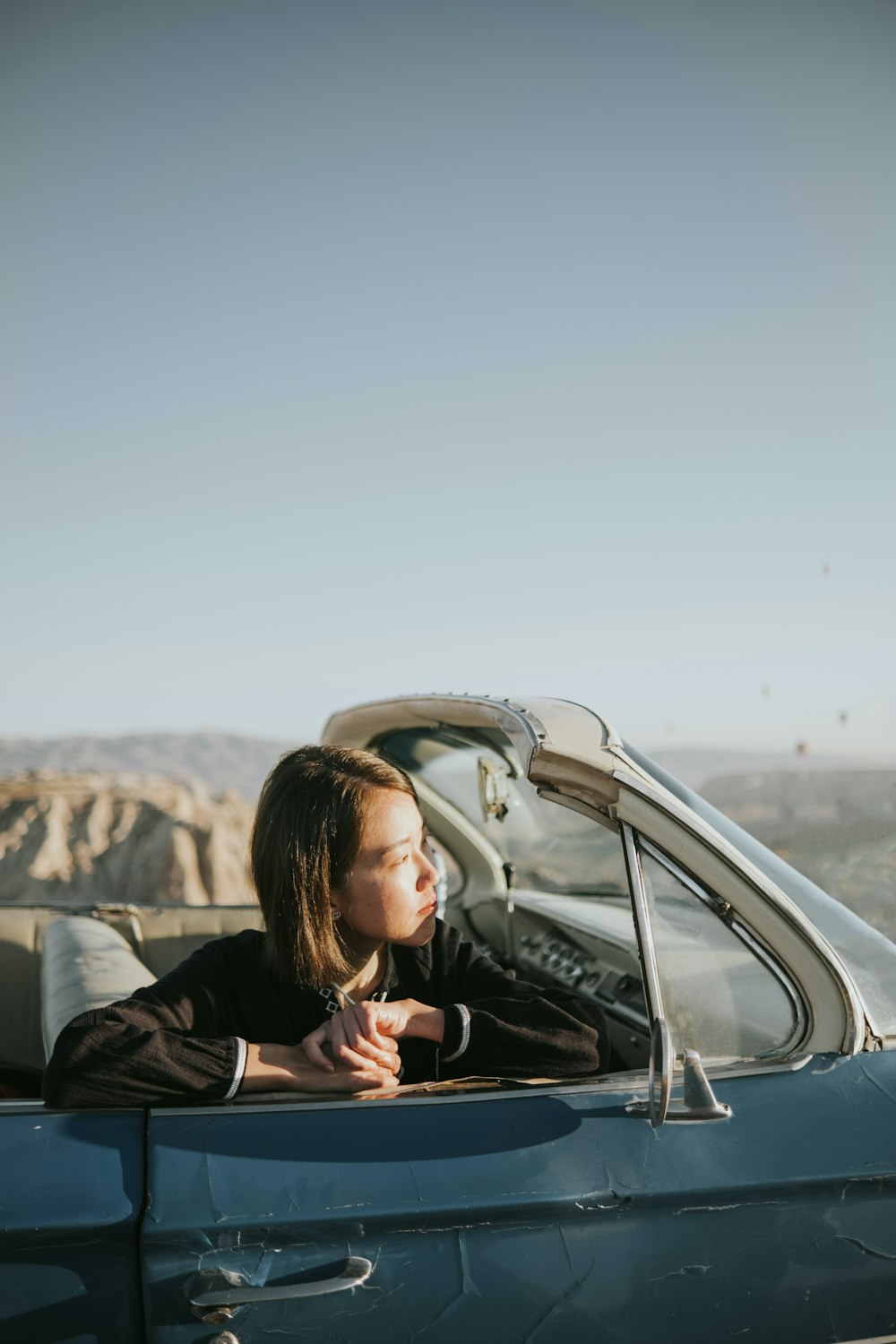 a person sleeping in a car