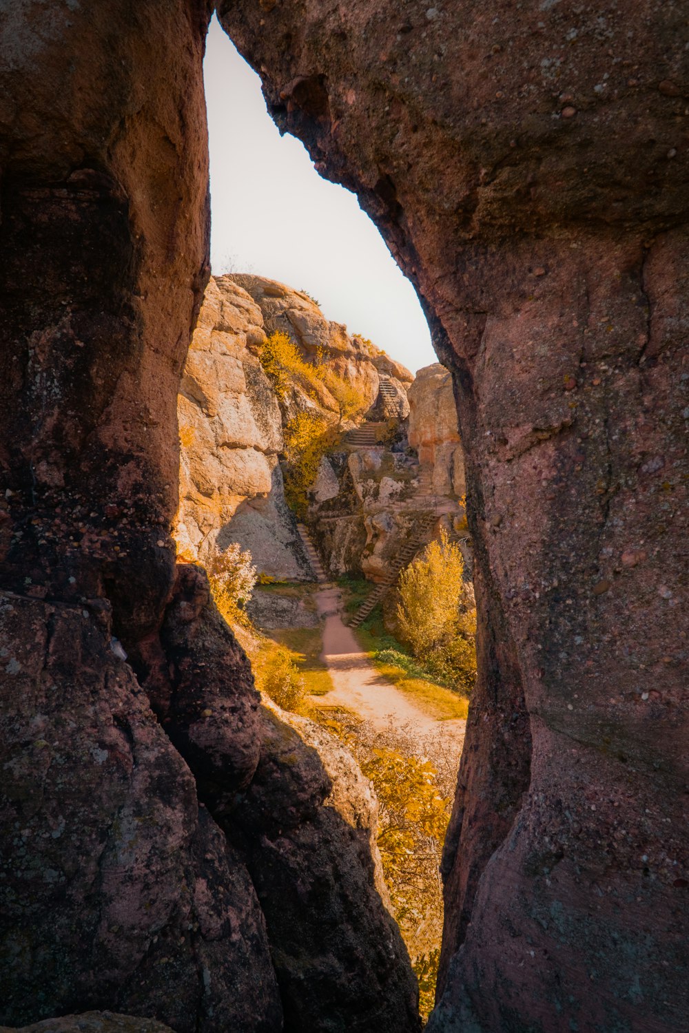 a stone archway with a river running through it