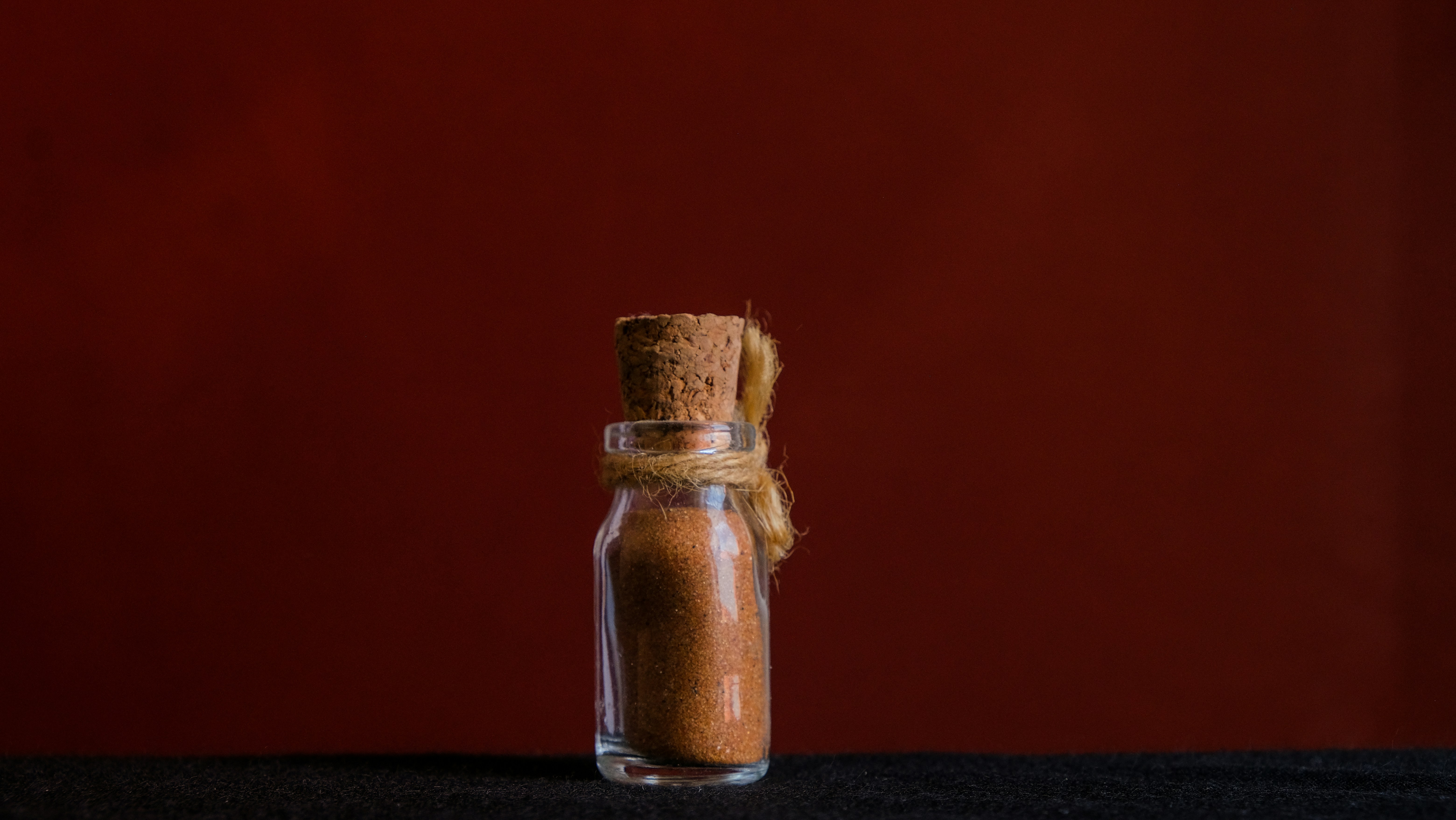 a glass jar with a brown substance