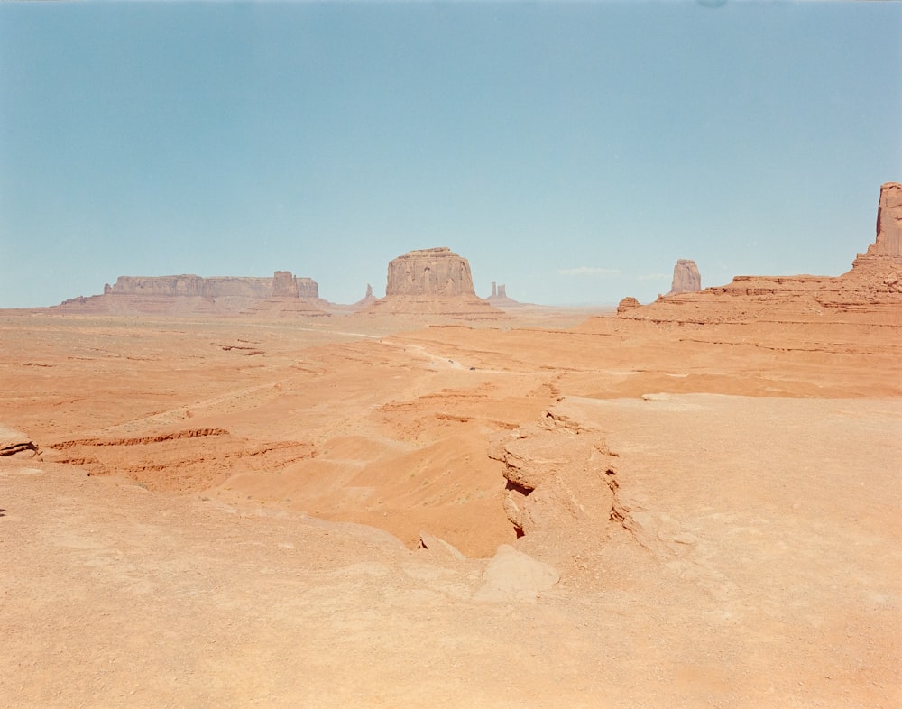 a desert with a few buildings