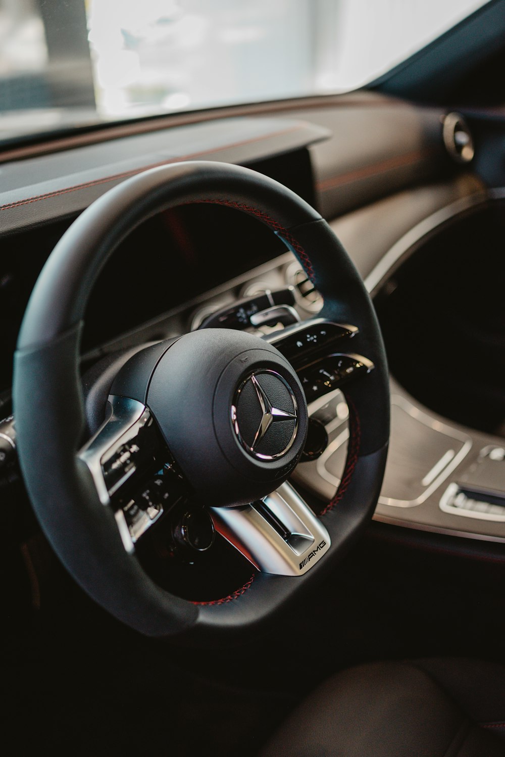 a steering wheel and dashboard of a car