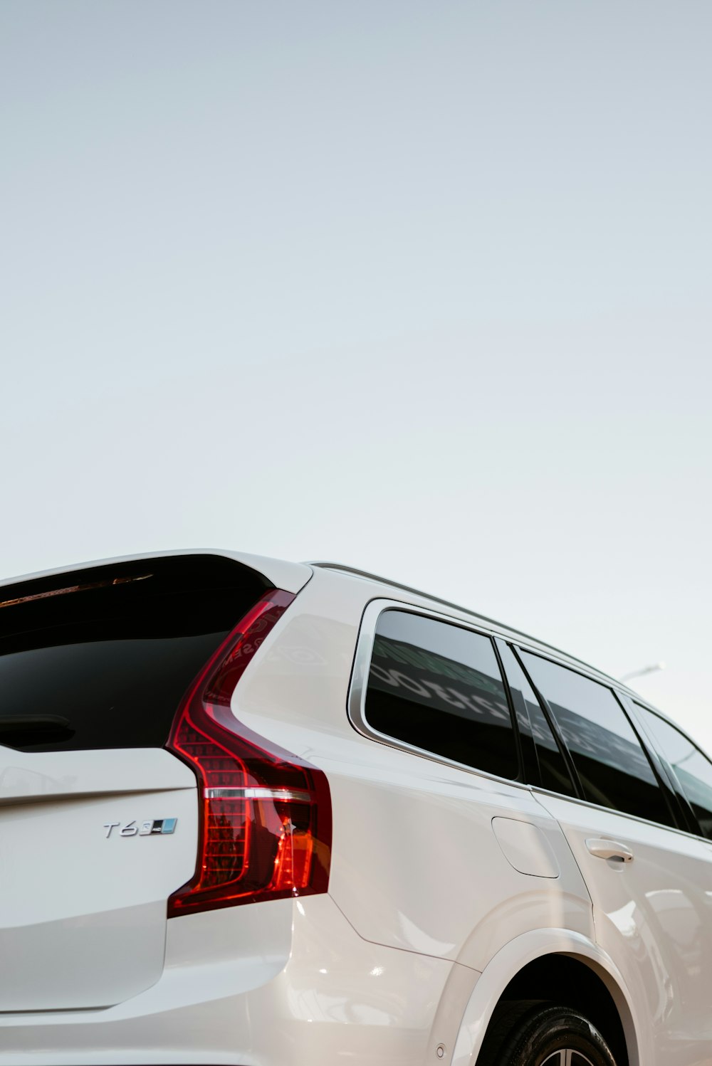 a white car with its trunk facing the camera