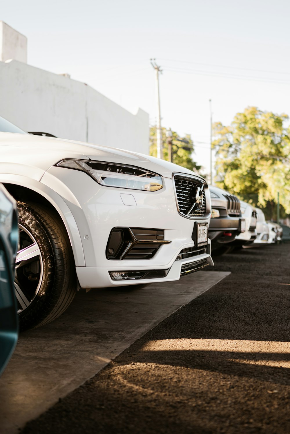 a white car parked in a parking lot