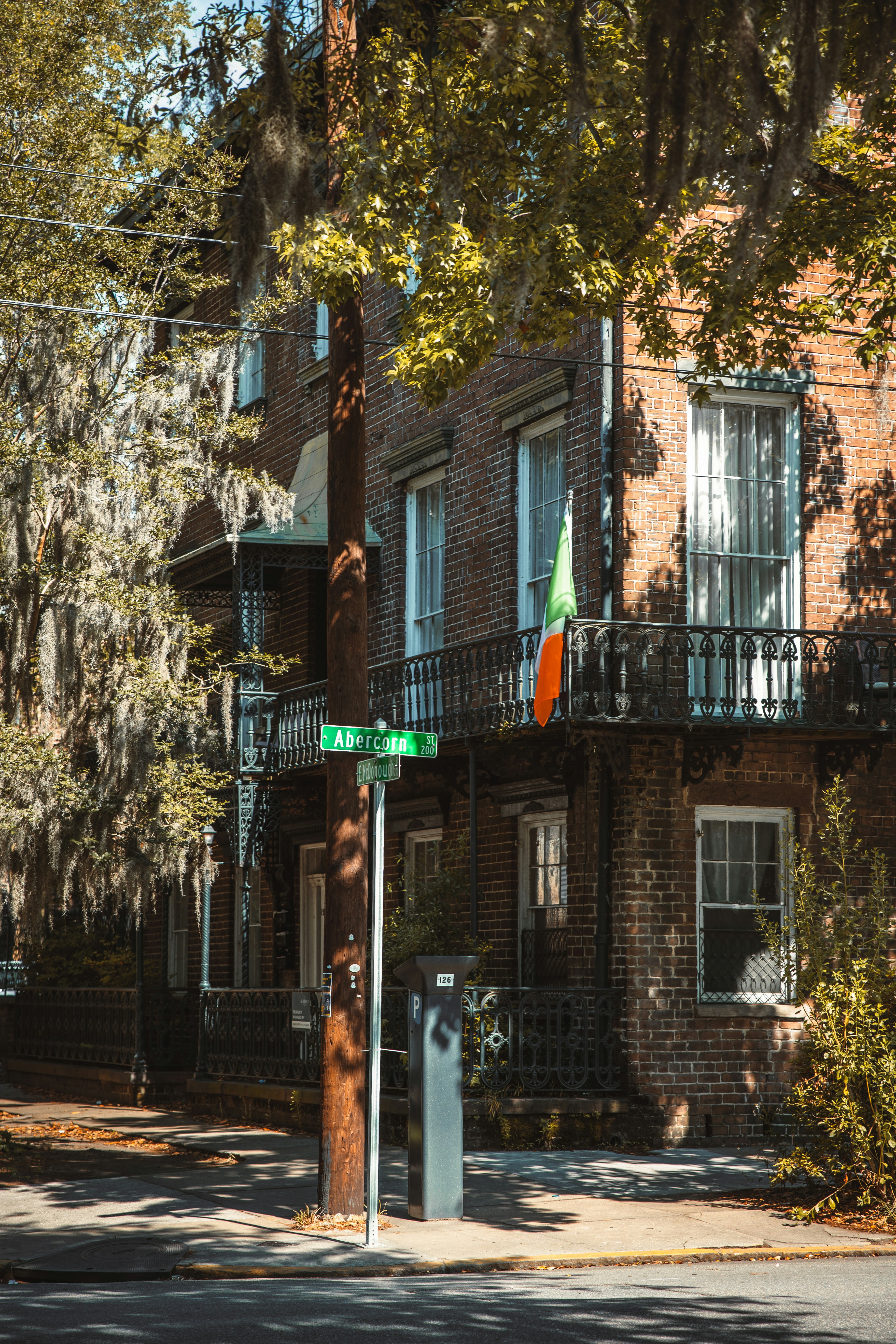 a brick building with a flag on the corner