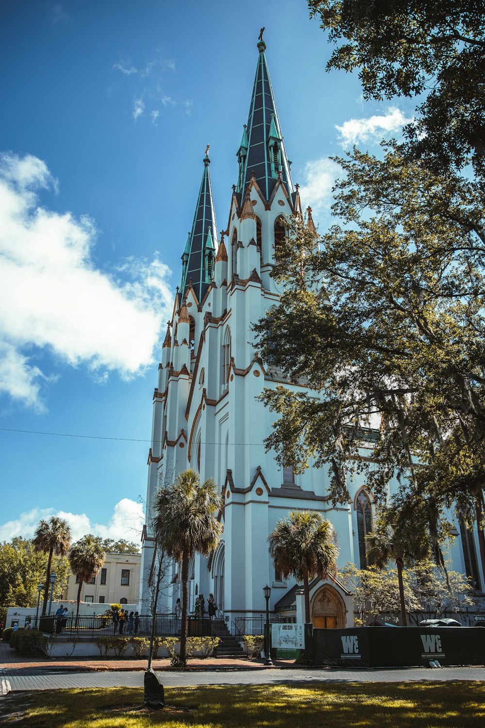 a tall white building with a tall pointy tower