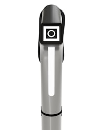 A sleek, vertical silver and black object with a rectangular digital display near the top. The display features a white circle within a square against a black background. The object has a modern, minimalistic design, possibly indicating a piece of technology or electronic equipment.