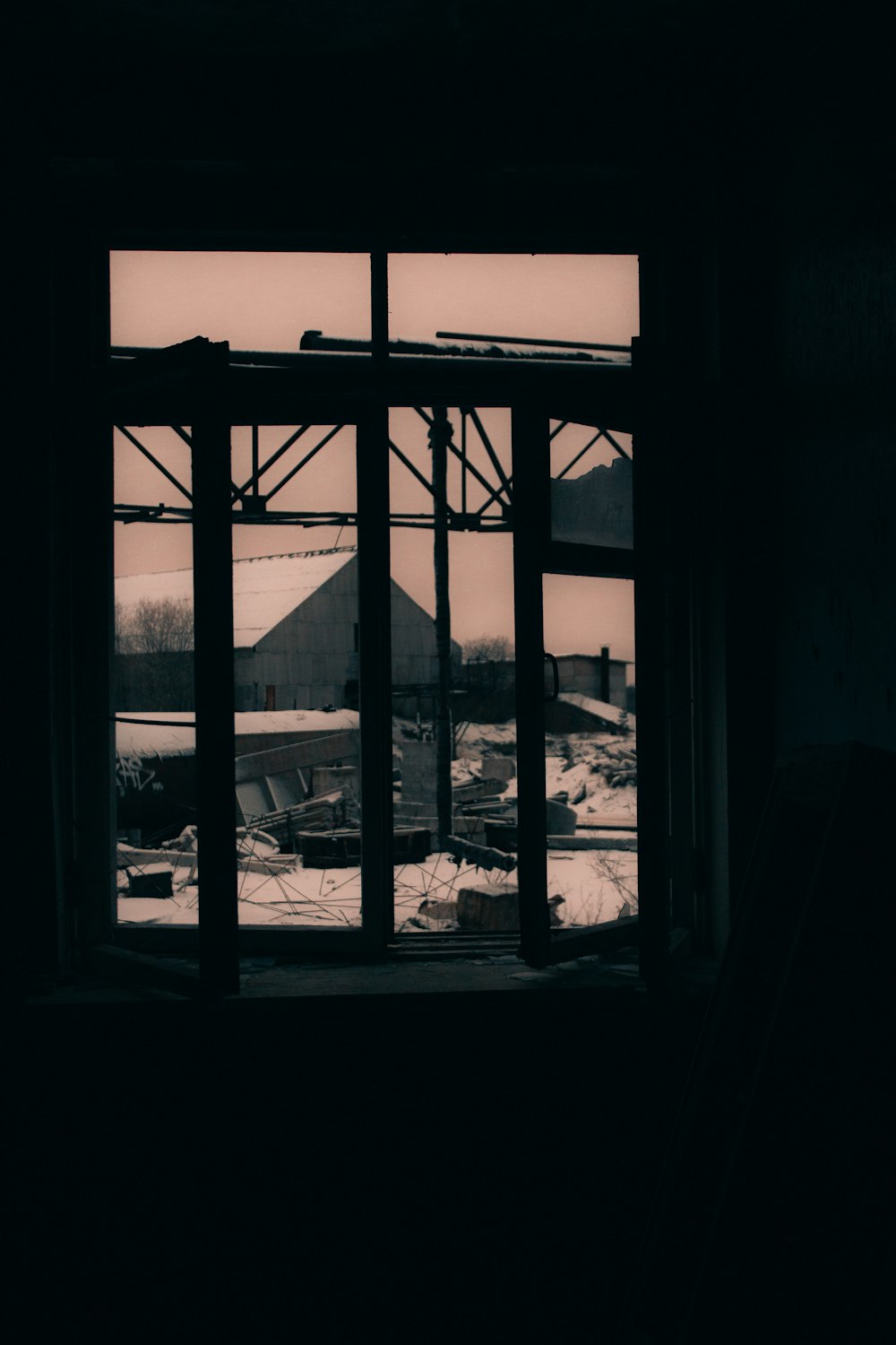 a window with a view of a boat and a bridge