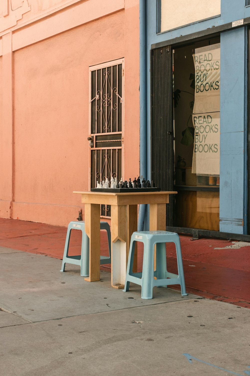 a table and chairs outside a building