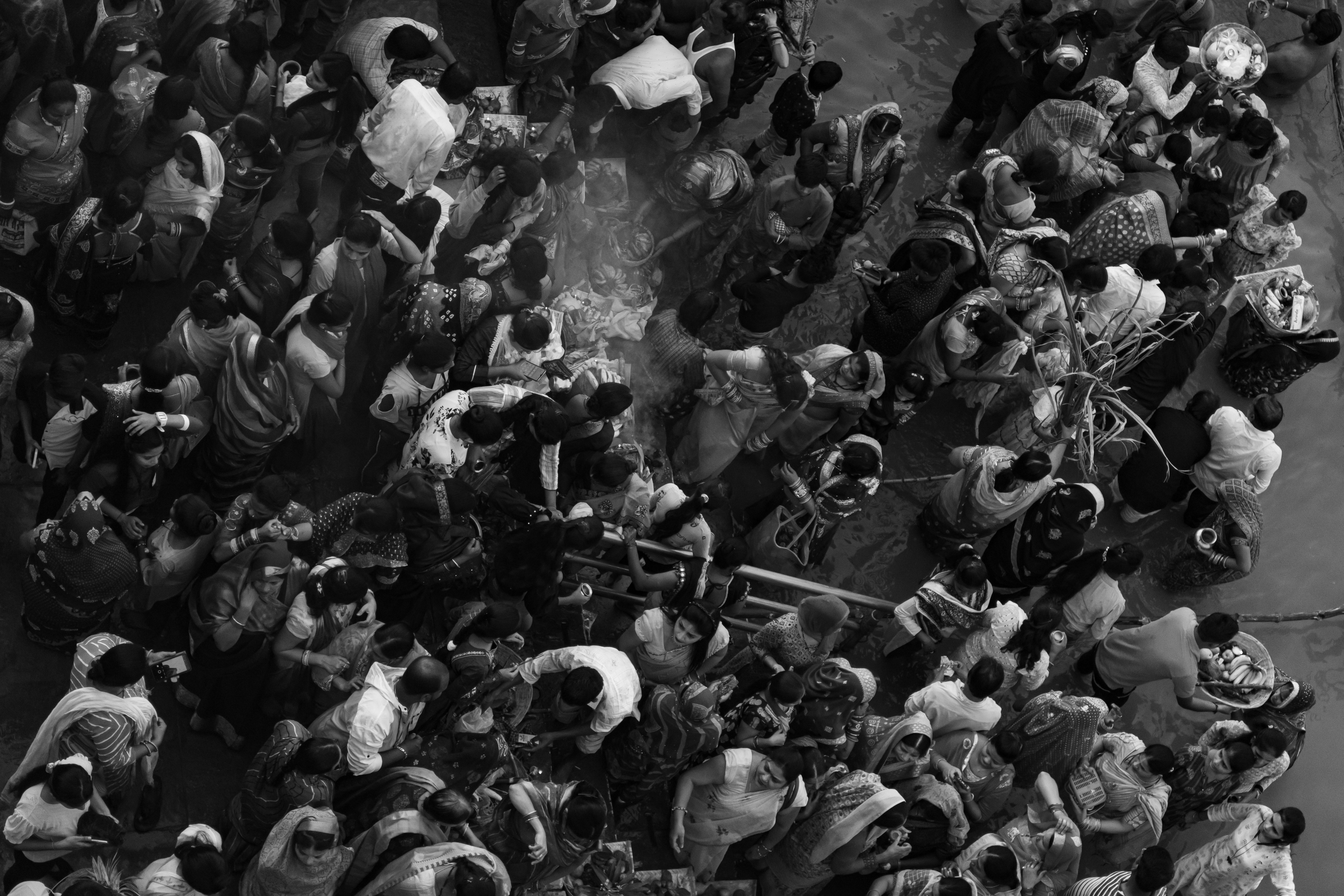 A single journalist, looking determined, sits alone in a dimly lit newsroom, surrounded by screens displaying complex data and news feeds, symbolizing the struggle for independent reporting.