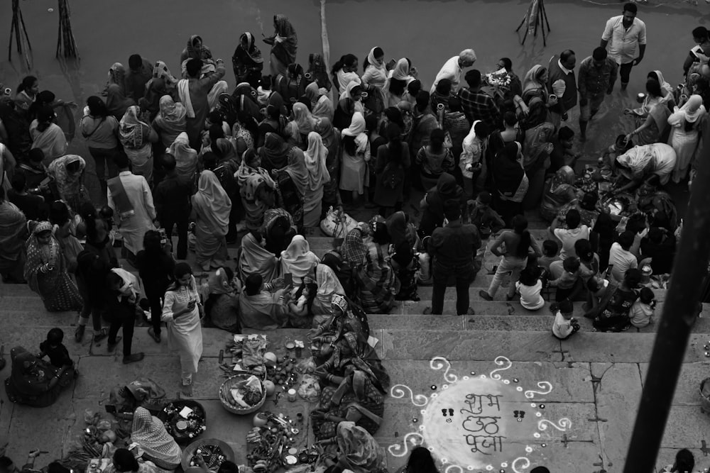 a crowd of people around a memorial