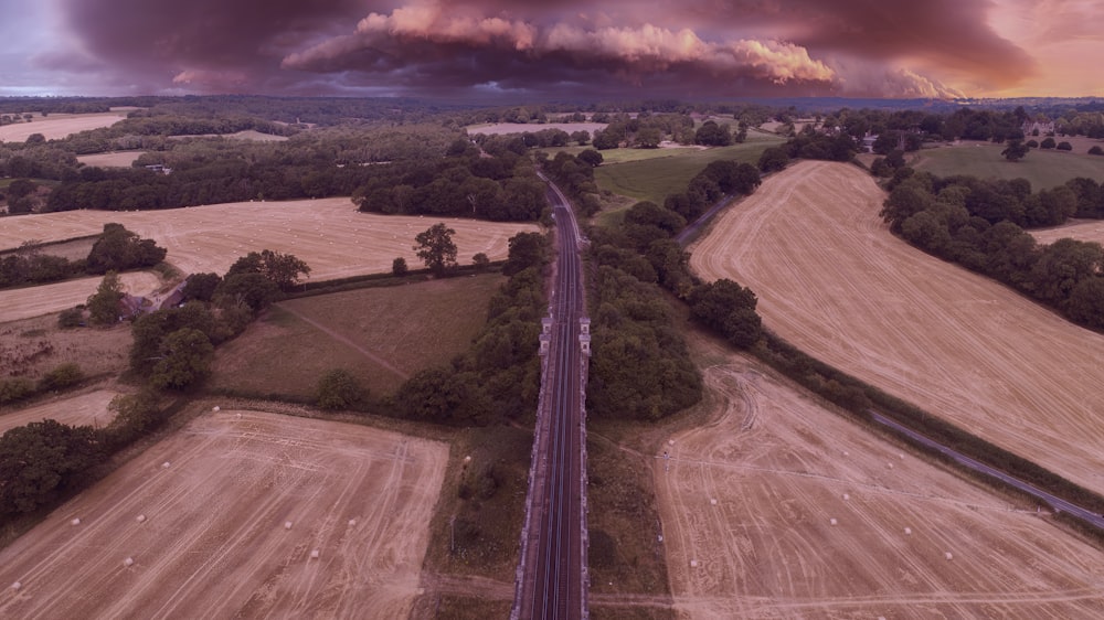 a long road going through a field