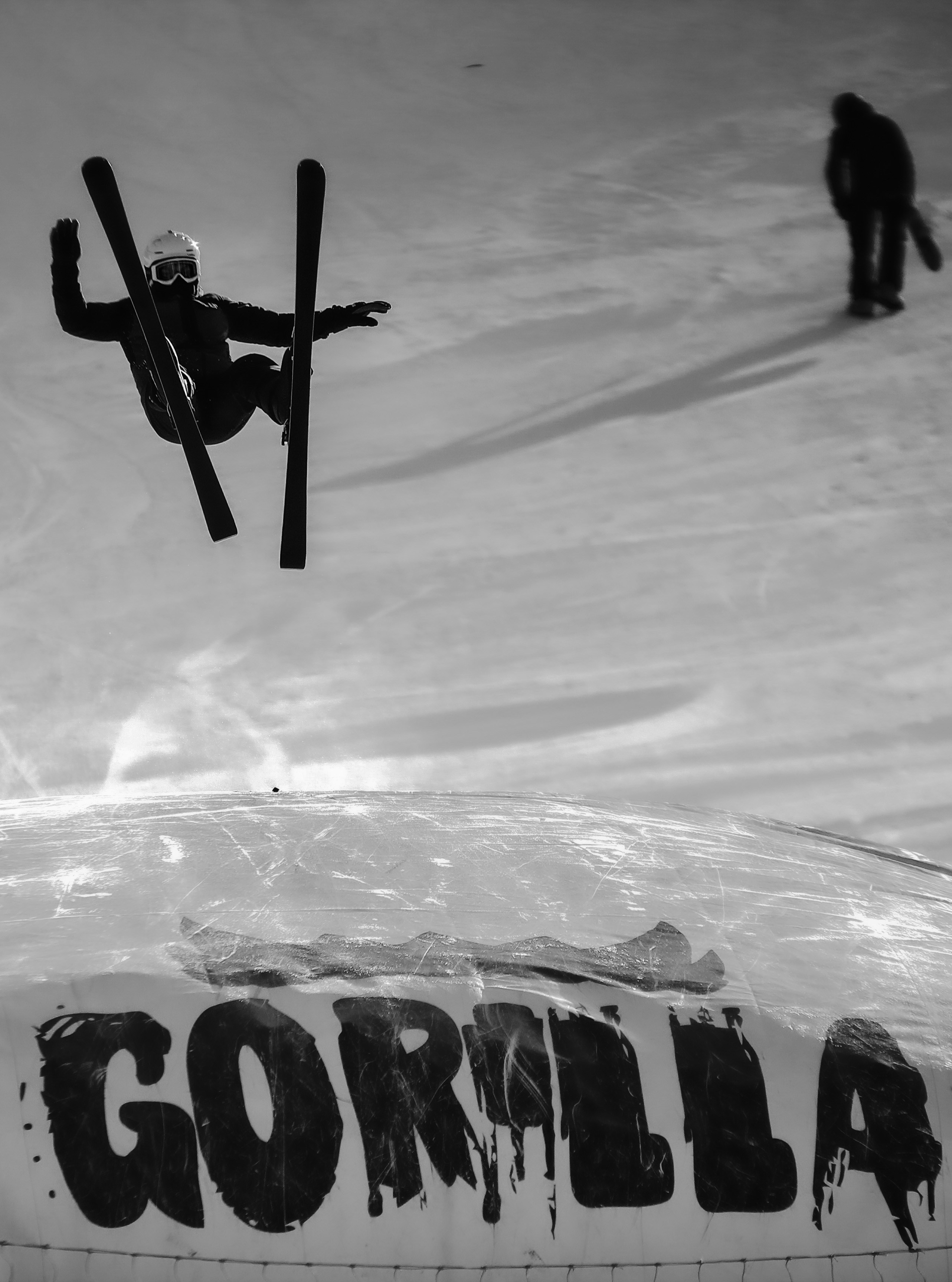a person doing a flip on a snowboard