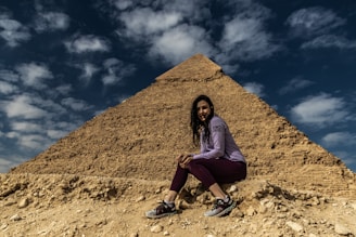a person sitting on a rock