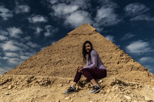 a person sitting on a rock