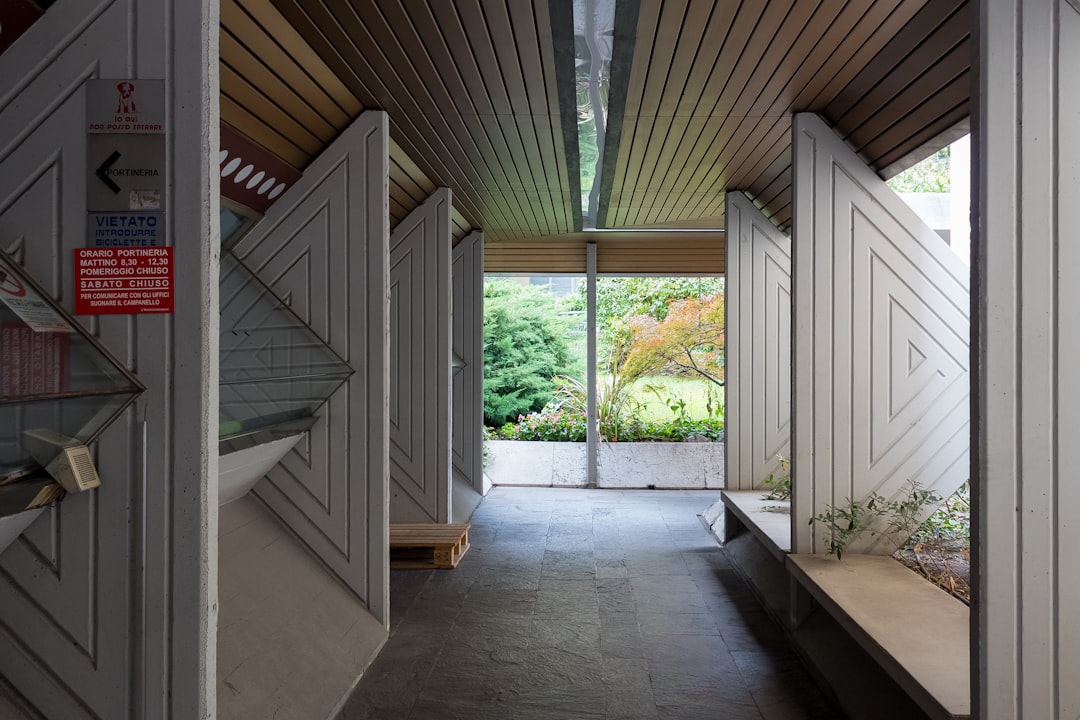 a building with a wood floor and a wood roof, The incredible Carlo Scarpa details in the Banca Popolare di Verona.