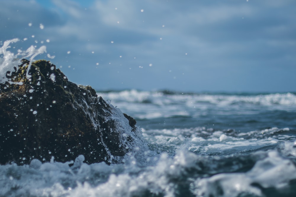 waves crashing against a rock