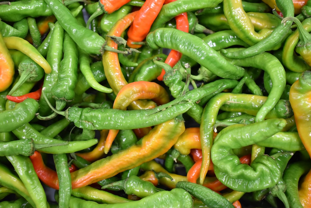 a pile of green peppers