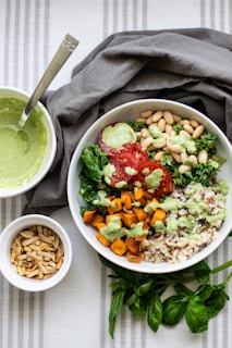 a bowl of salad and a bowl of rice
