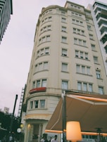 Exterior view of occupacco PG building located behind Apollo Hospitals.