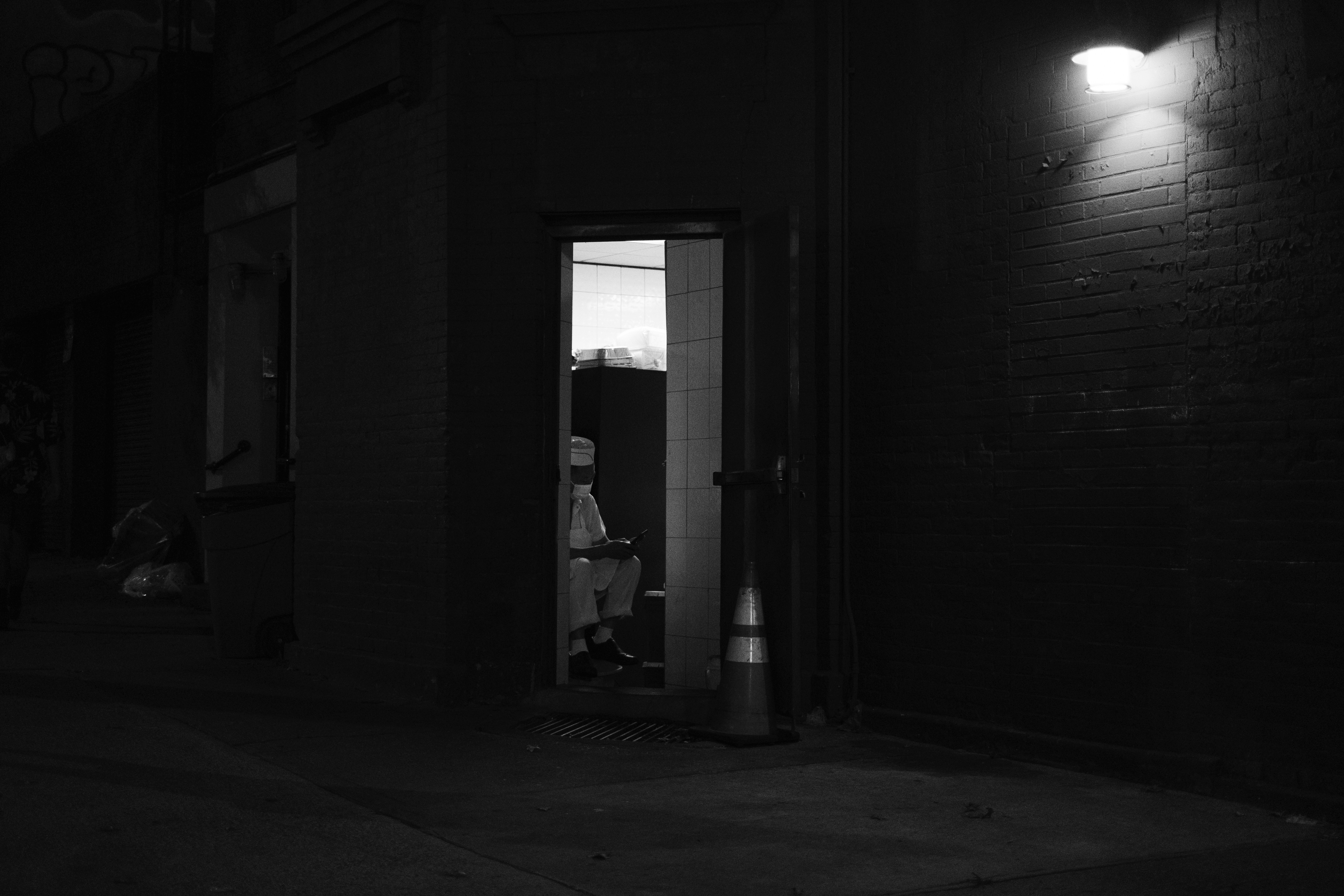 a person sitting in a doorway