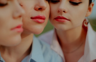 A diverse group of smiling women showcasing their makeup looks, each with radiant, smooth skin.