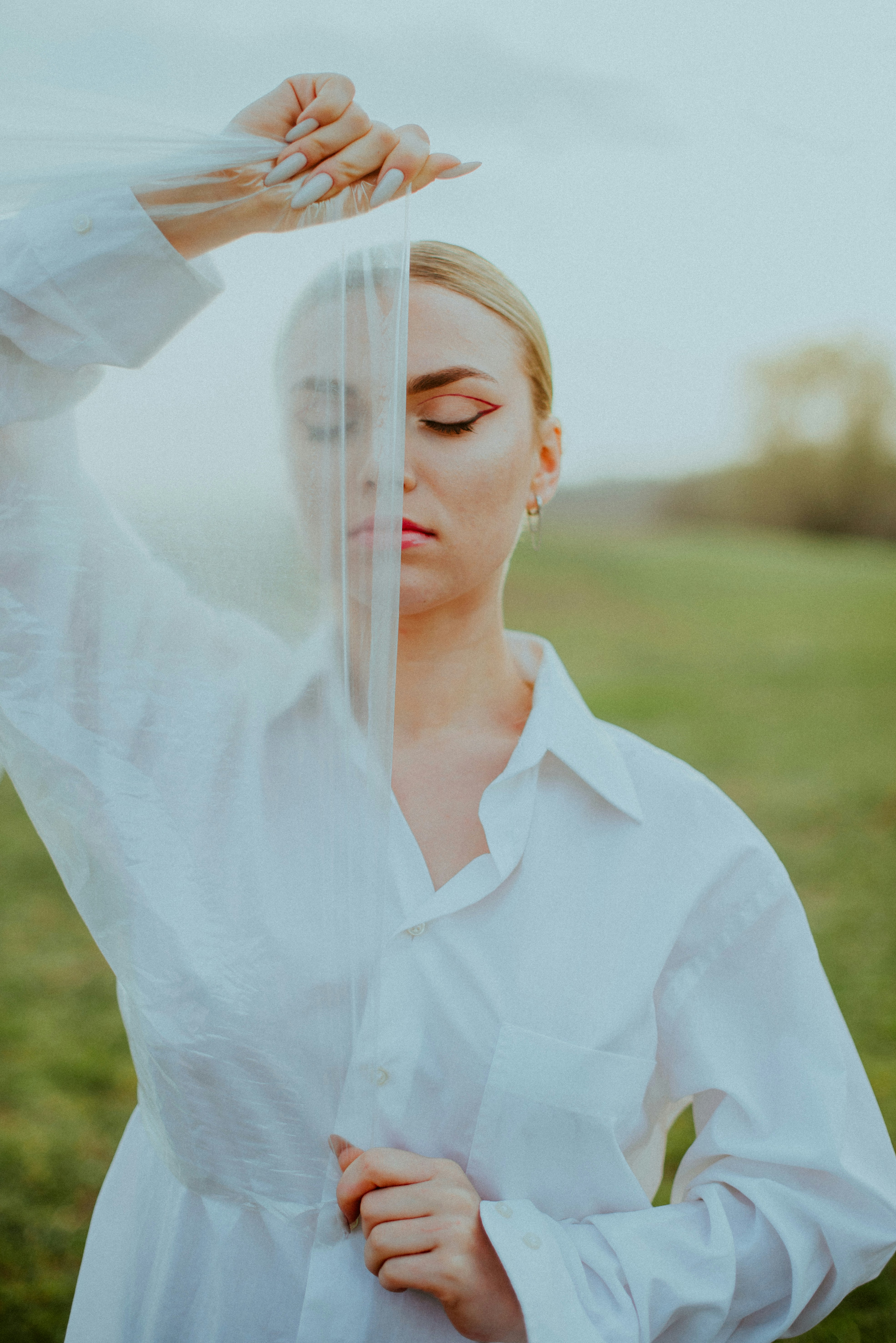 a person with the hair blowing in the wind