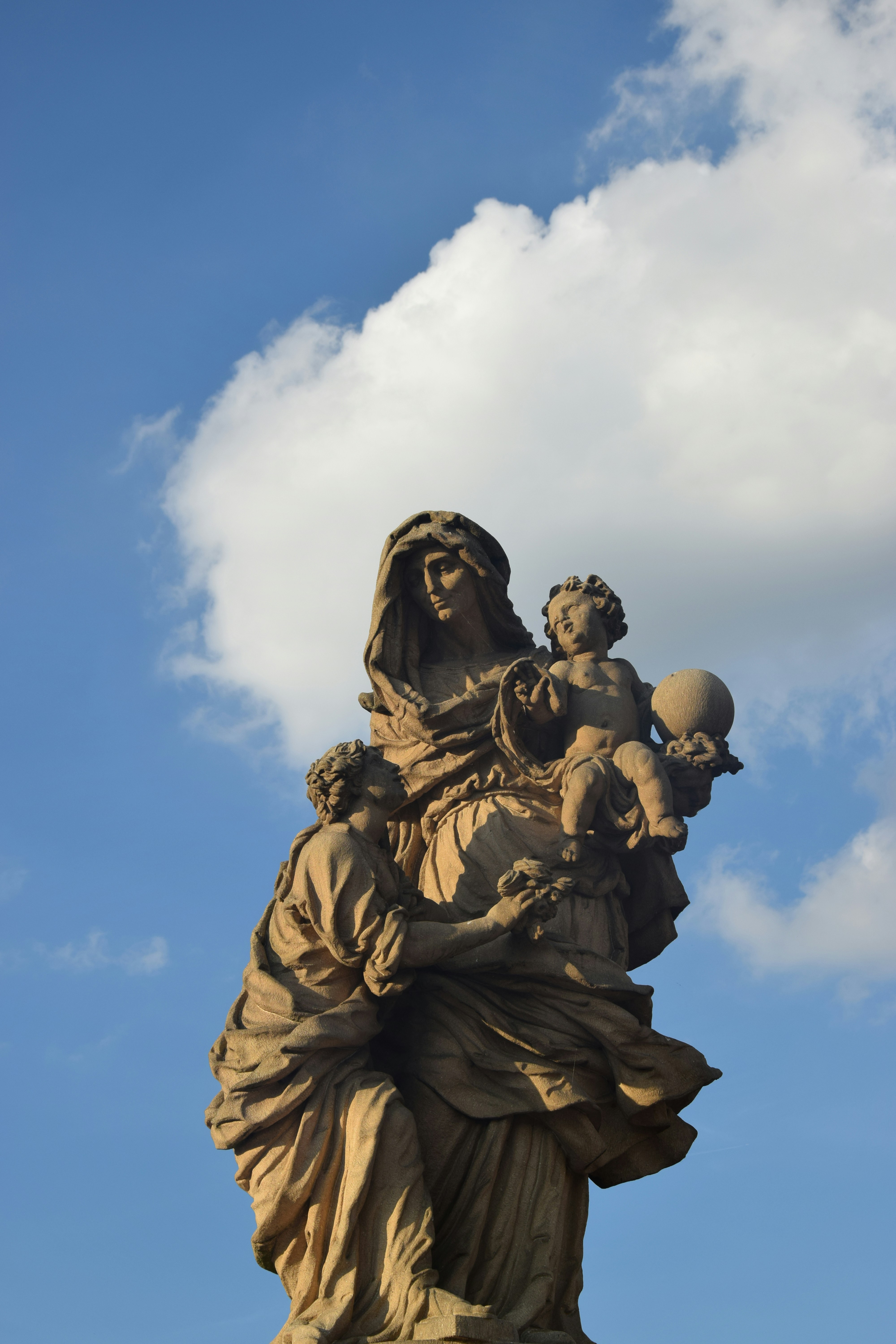 a statue of a person holding a baby