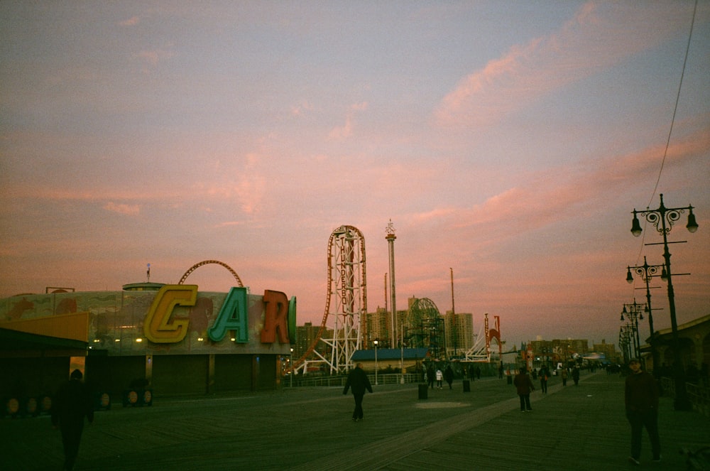a group of people walking around a fair