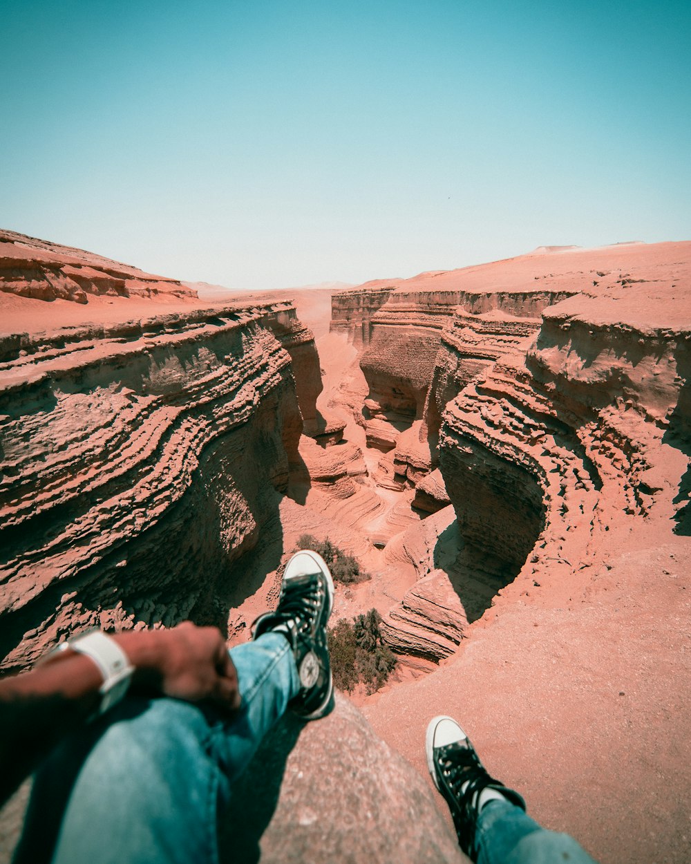 a person sitting on a rock