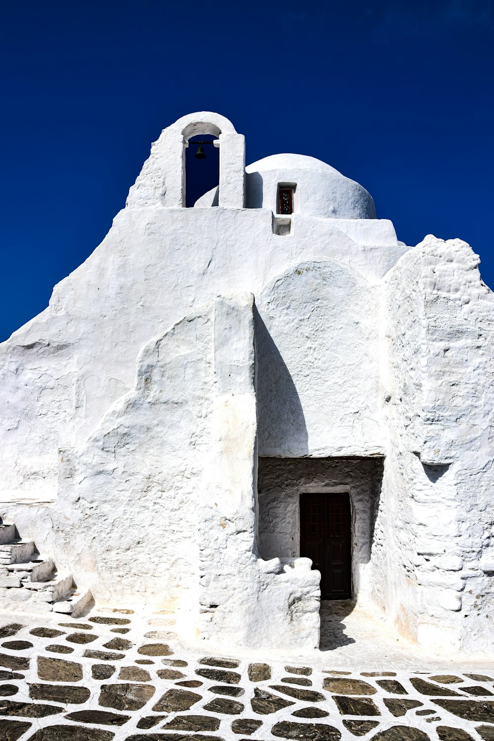 a stone building with a door