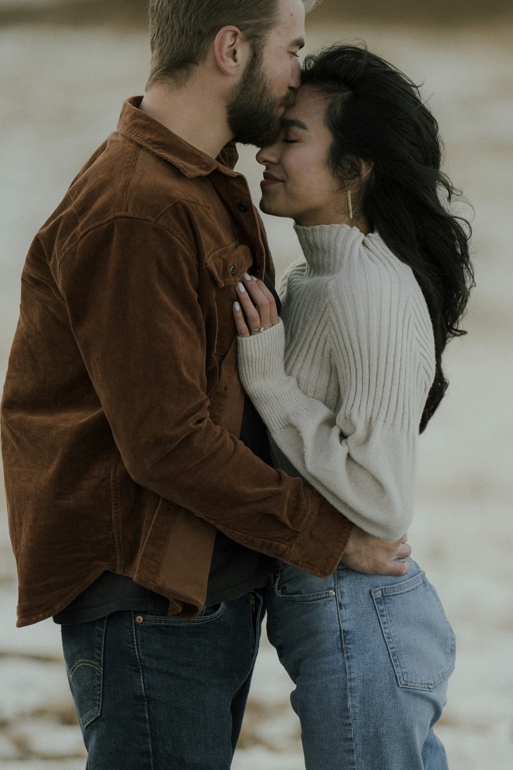 a man and woman kissing