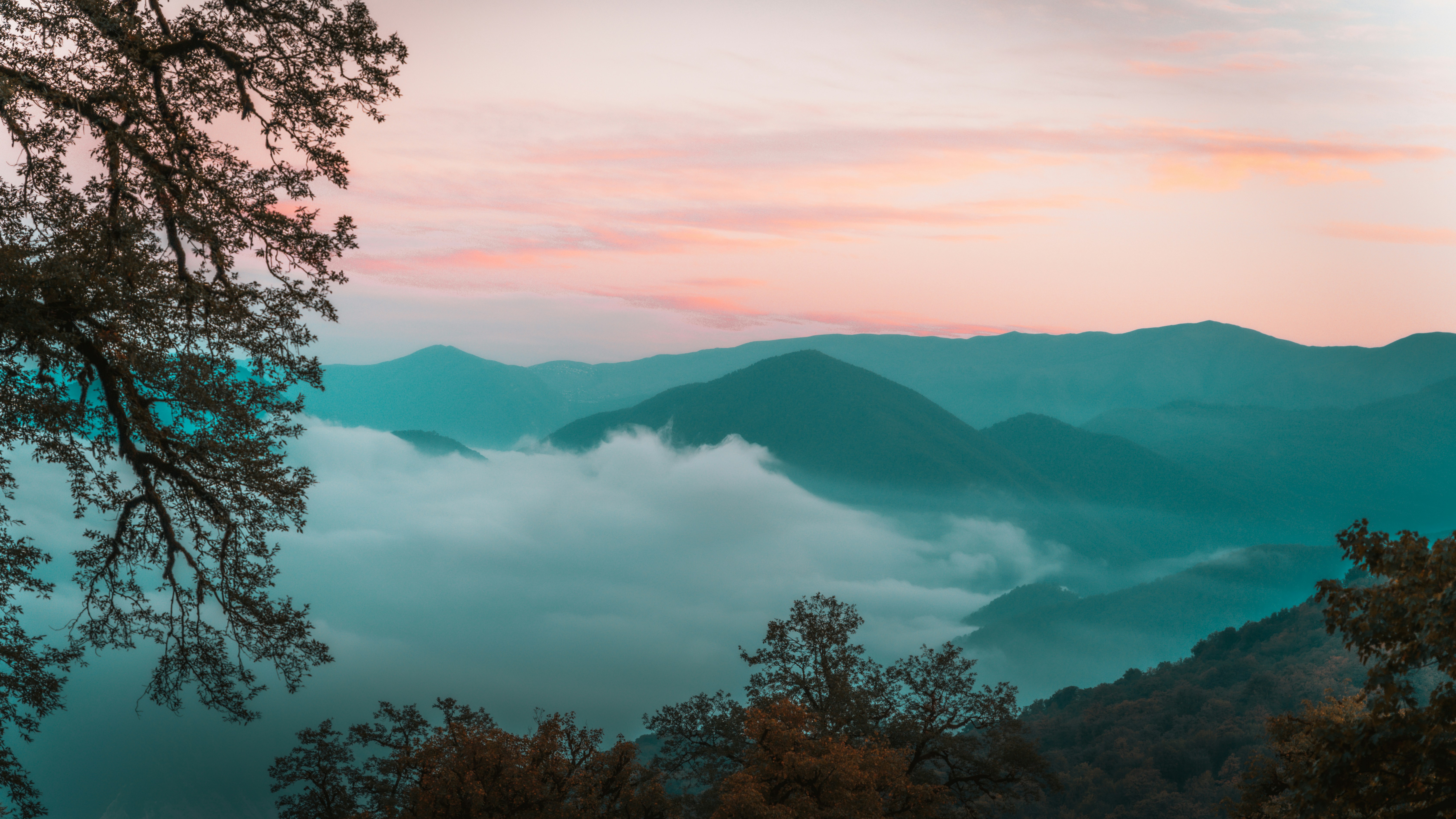 a view of the mountains and clouds