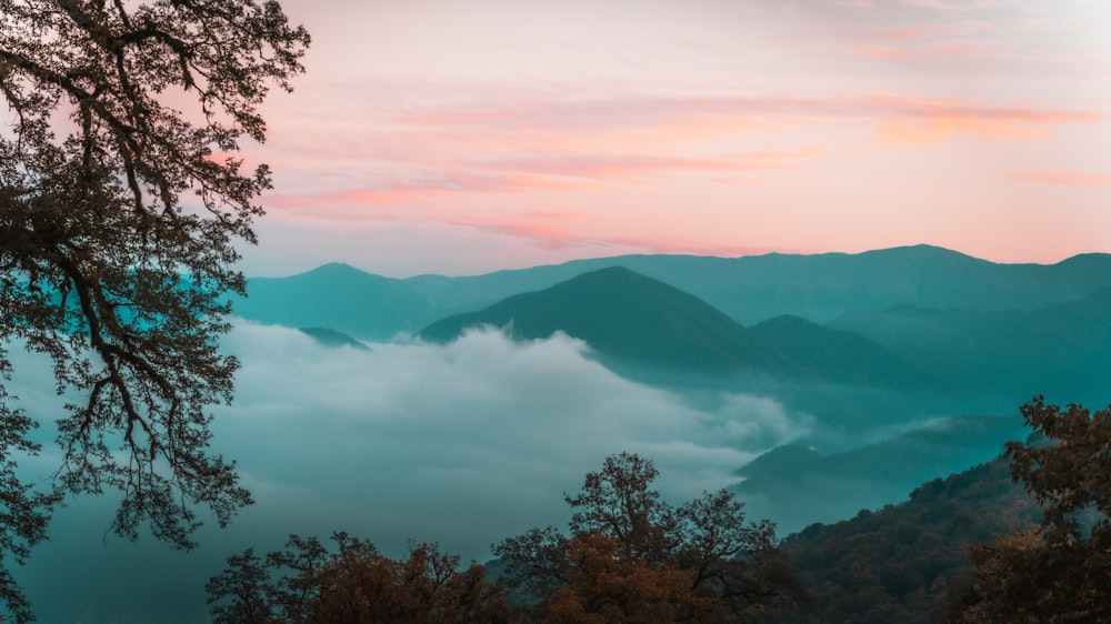 a view of the mountains and clouds