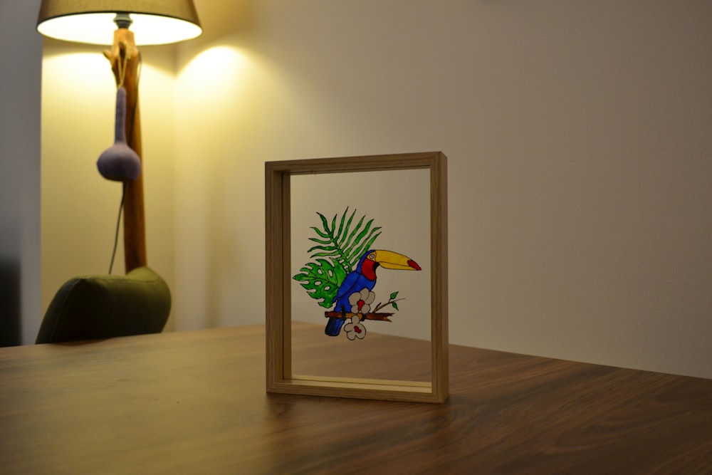 a framed picture of a bird