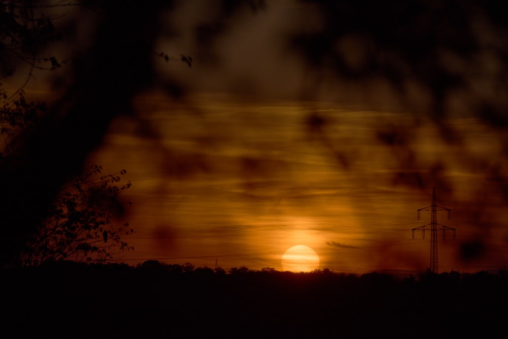 a sunset over a field