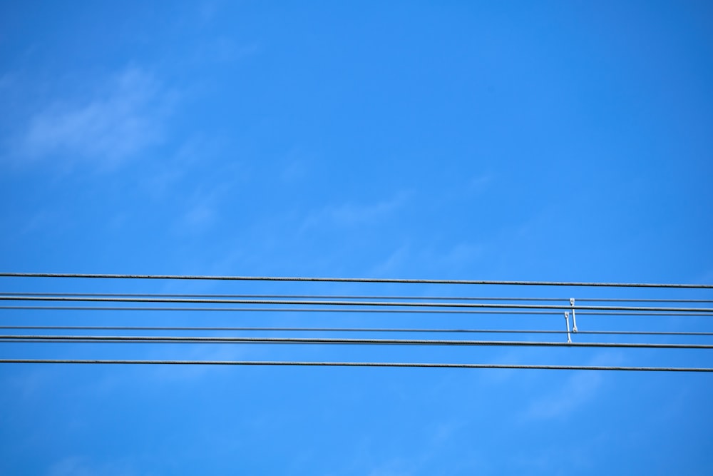 a blue sky with some power lines