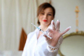 a woman holding a pen