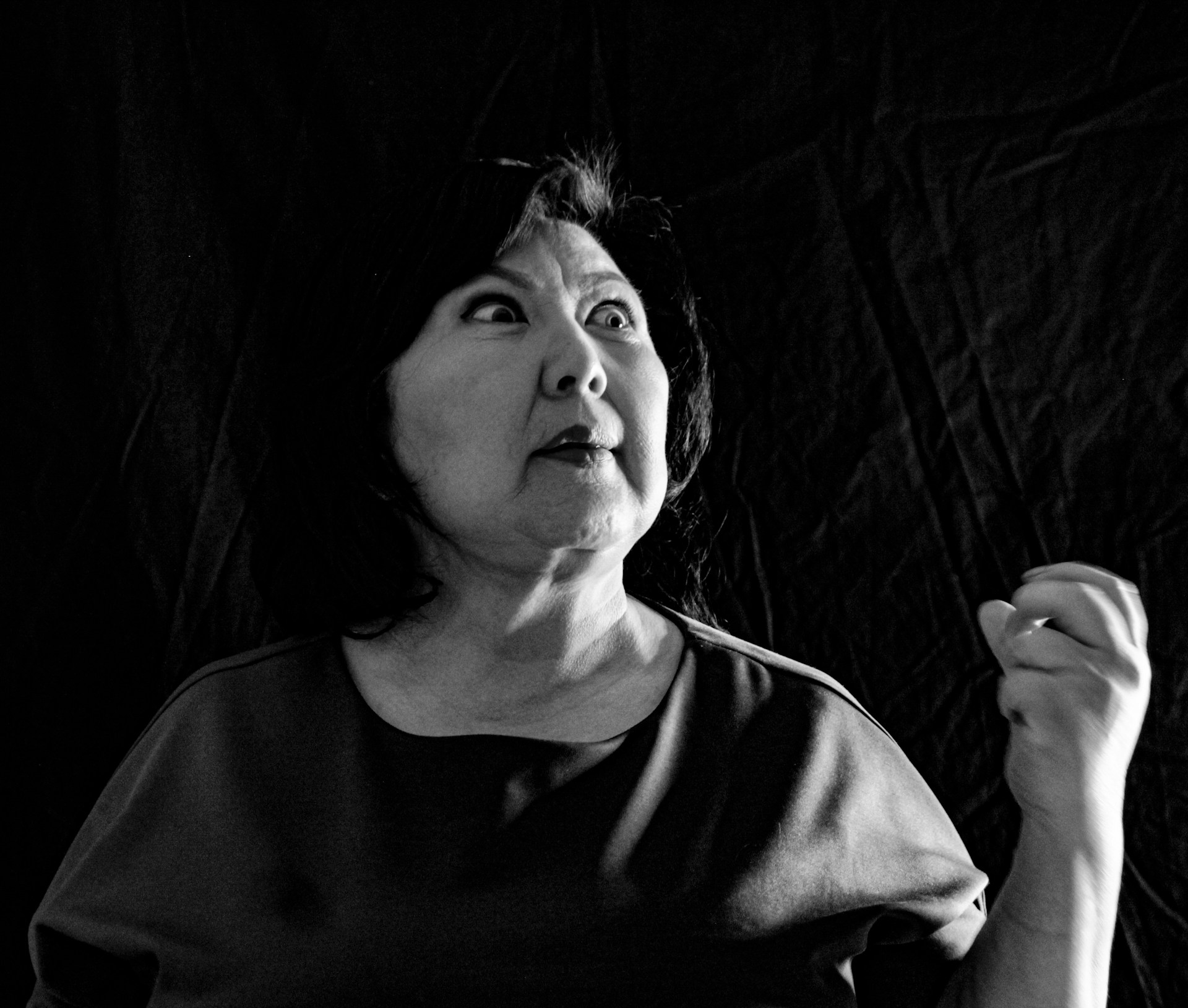 A black-and-white portrait of Jane Perlmutter in her younger years, eyes full of hope and determination.