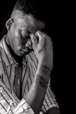 Close-up of a hand applying a colorful anti-stress patch on the wrist, showing before and after calm expressions.