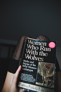 a hand holding a book