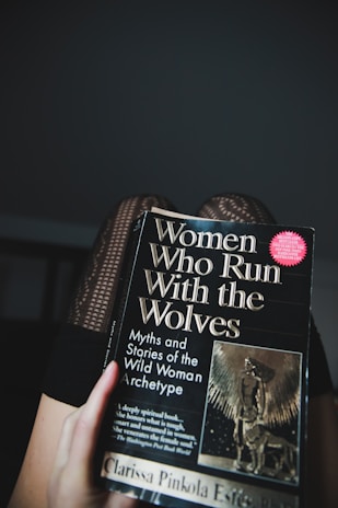 a hand holding a book