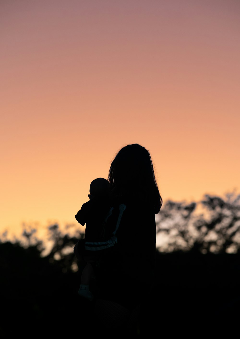silhouette of a person and a child