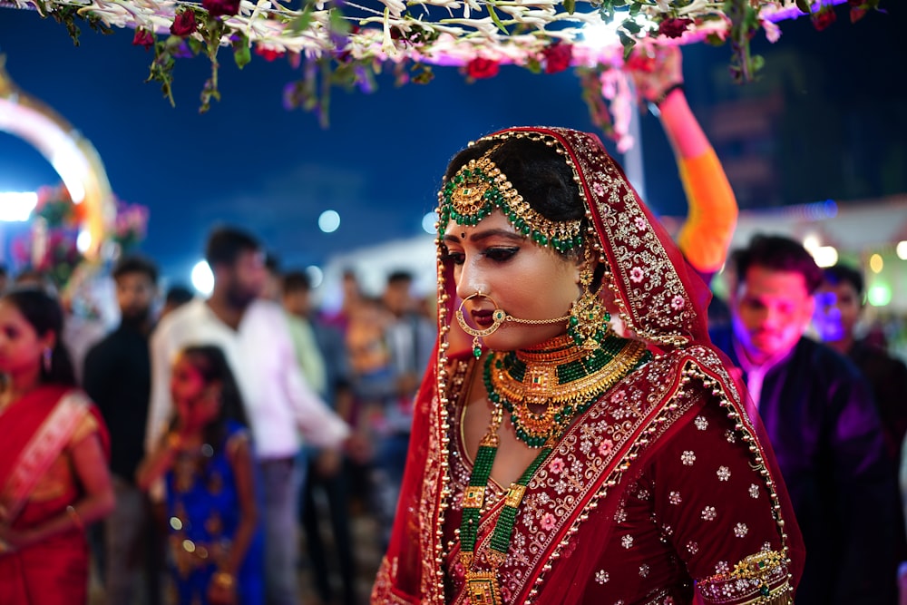 a person wearing a colorful headdress and a colorful dress