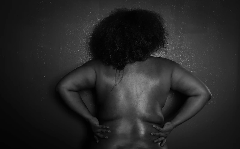 shirtless confident individual embracing self-love