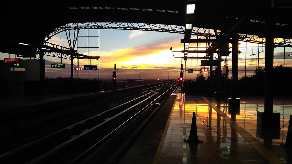 a train station at sunset