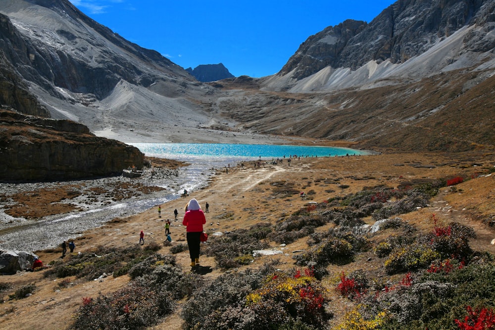 a person standing on a rocky hillside