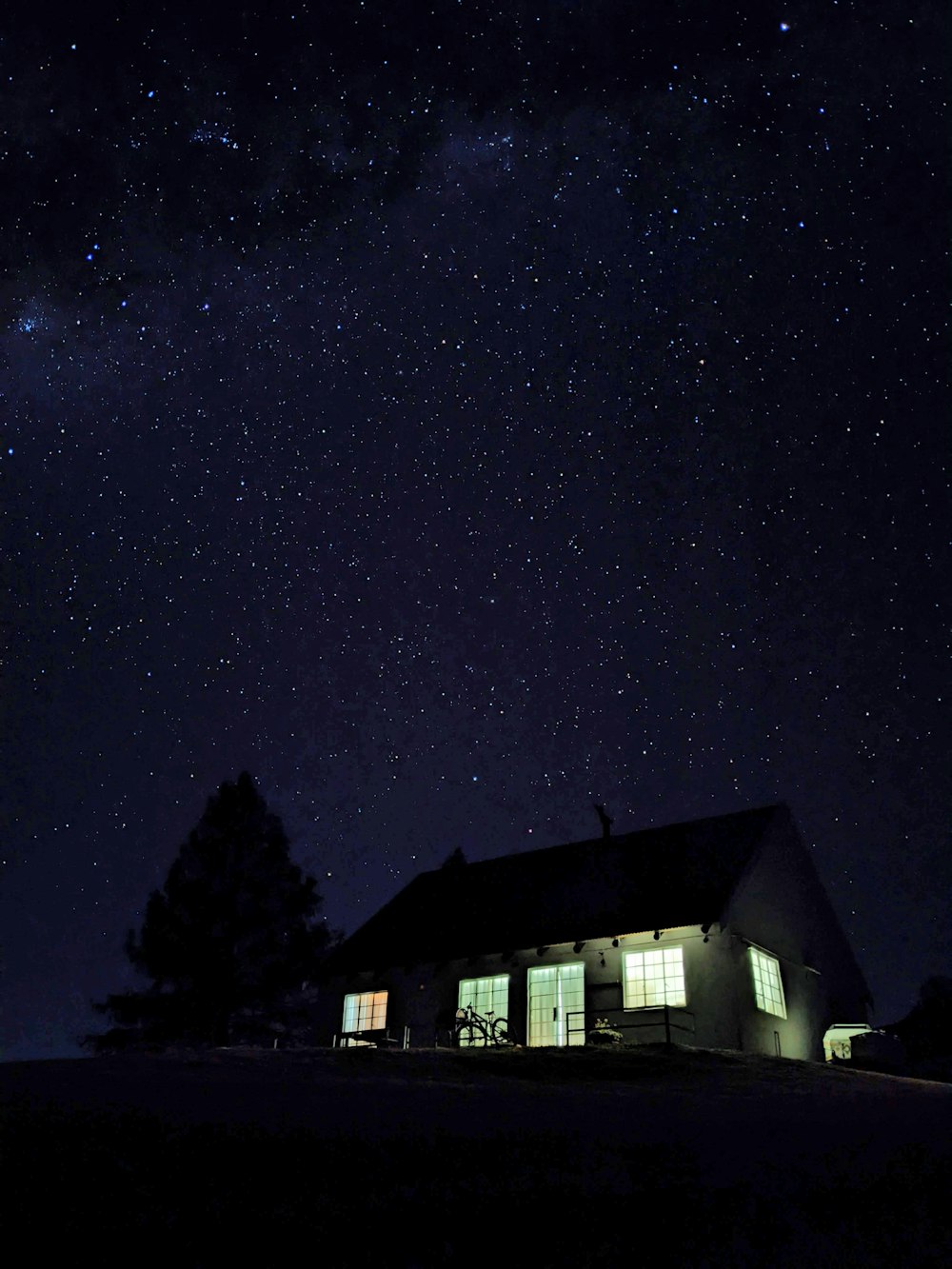 a house with a starry sky above it