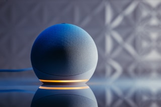 a blue ball on a black surface