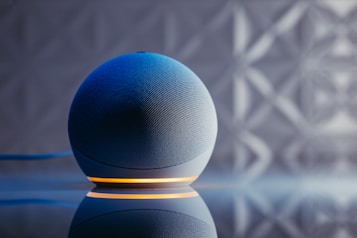a blue ball on a black surface