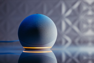 a blue ball on a black surface